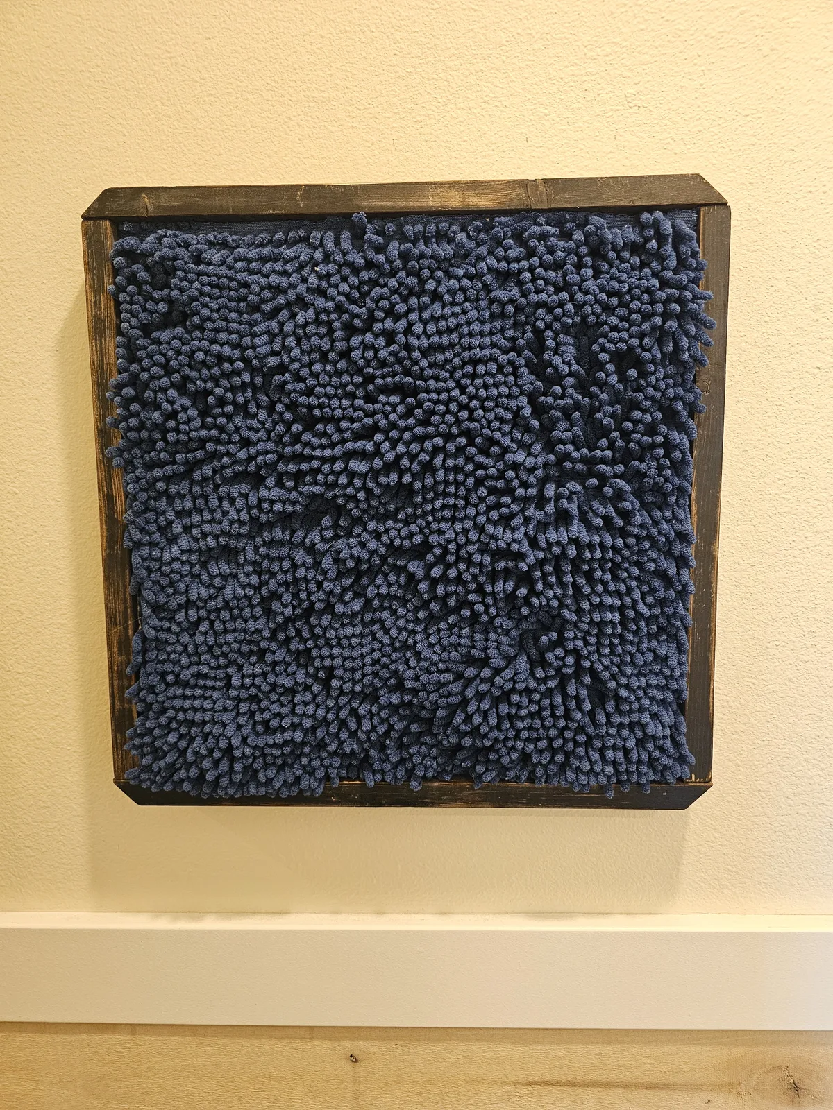 Blue chenille textile art, a soft tactile sensory station