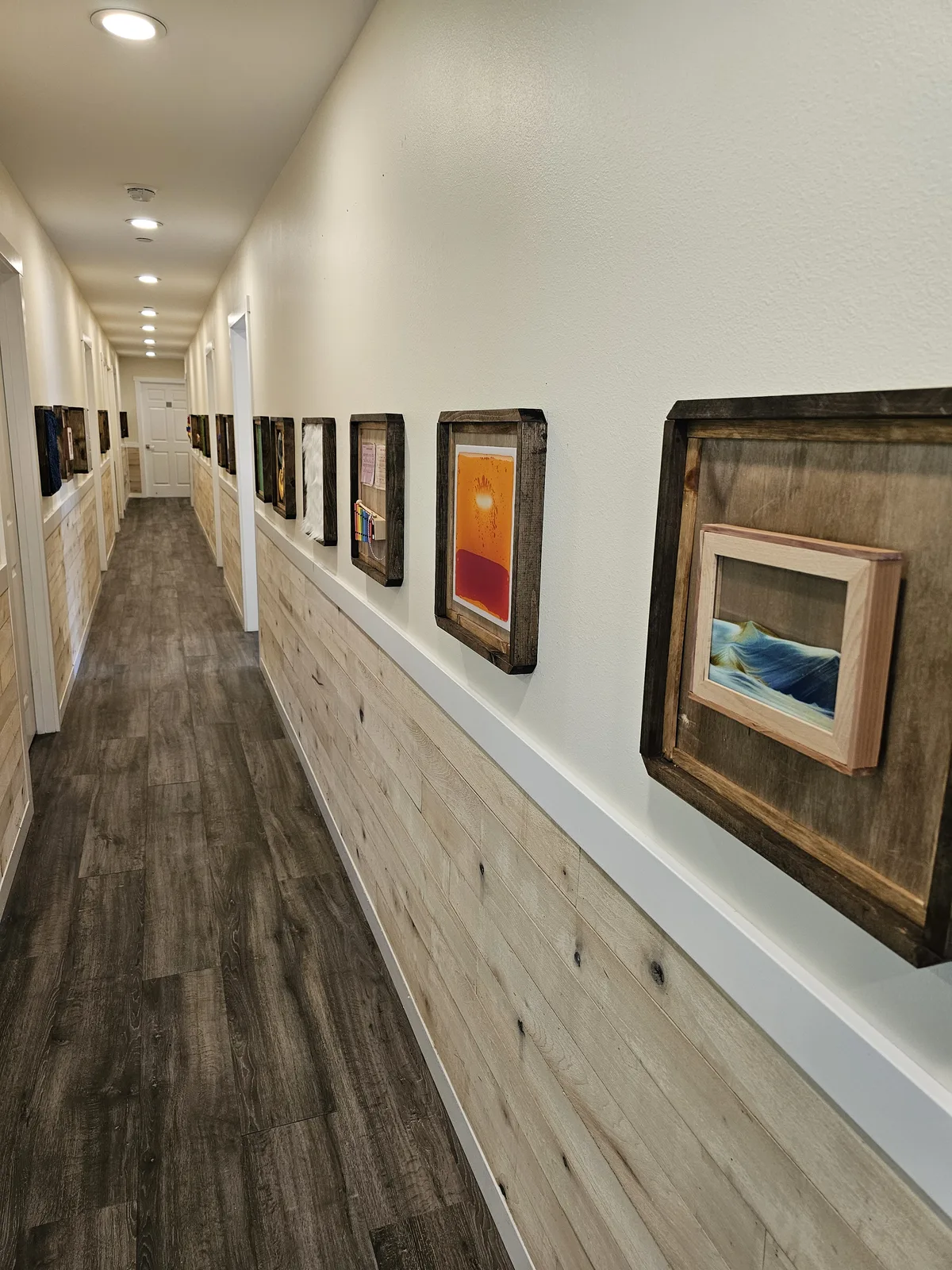 The sensory hallway at Burien Best Care Home, lined with handmade interactive art stations