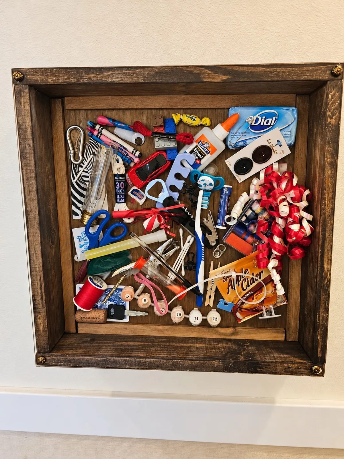 I-spy shadowbox filled with everyday objects, a visual search game for cognitive stimulation